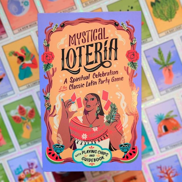 Photo of the box of “Mystical Lotería: A Spiritual Celebration of the Classic Latin Party Game” laid above face-up cards from the game